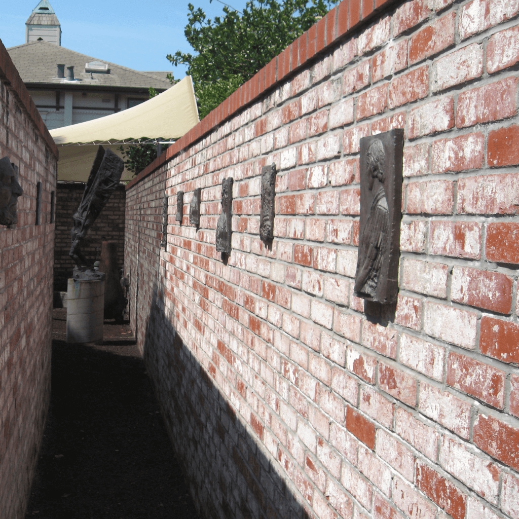 Brick hallway with mounted coper plaques