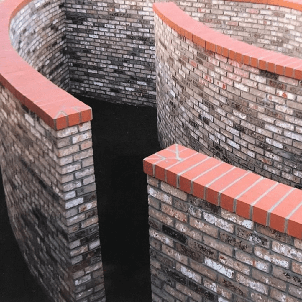 curved brick maze walls, constructed in Sonoma County