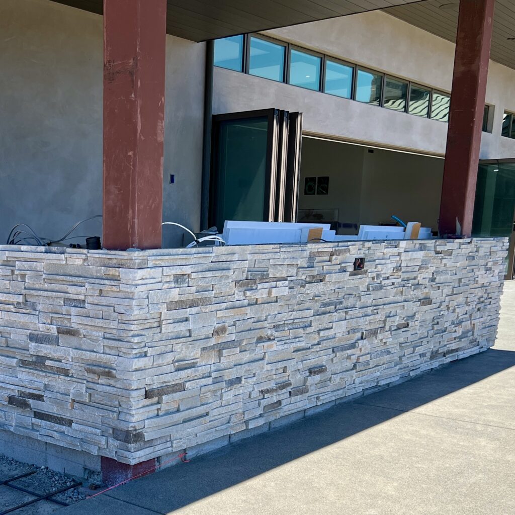 Residential thin stone veneer masonry wall on patio in Santa Rosa